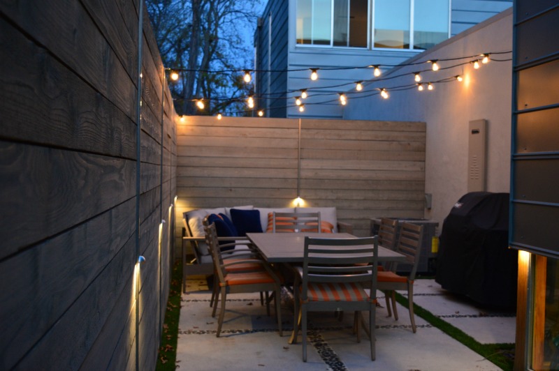 string lighting over small outdoor patio